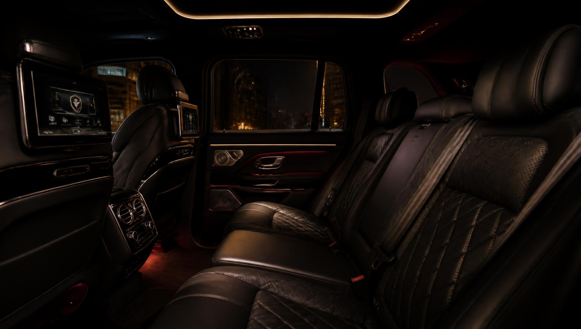 Black leather rear seating inside a luxury SUV